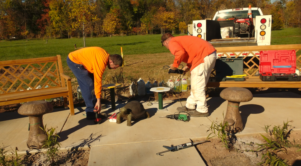 Members of Jim Twigg's City maintenance crew installed the children's seats. Within minutes the first kids were walking up the path. They were eager to try out the new seats.